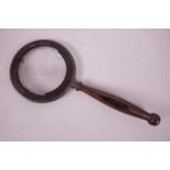 An antique treen handled, brass framed magnifying glass, 8½" long, A/F