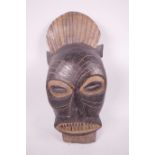 An African carved wood tribal mask, 13½" long