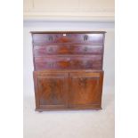 An early C19th mahogany press cupboard of three long drawers over two doors, 47½" x 20", 56" high