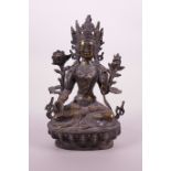 A Sino-Tibetan gilt bronze of a female deity, double vajra mark to base, 8½" high