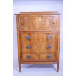 An American satinwood chest, with single drawer over three, the brass plated handles with profiles