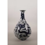 A Chinese pear shaped blue and white porcelain vase decorated with dragons, 6 character mark to