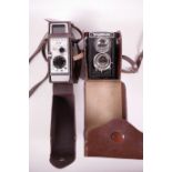 A G.B-Bell & Howell 642 8mm cine camera, together with a Voigtlander Brillant medium format camera