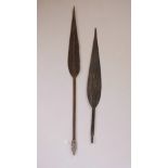 An Oceanic carved hardwood paddle spear, and another longer, 49" long