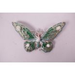 A silver and plique-à-jour Art Nouveau style brooch in the form of a butterfly with opalite panels