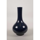 A Chinese blue glaze porcelain bottle vase, seal mark to base, 8½" high