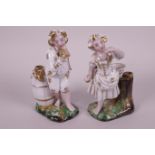 A pair of Continental hard-paste porcelain figural pen holders modelled as a boy and girl in gilt