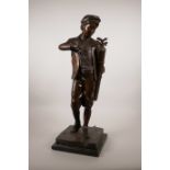 A patinated bronze lamp in the form of a golfer, 22" high