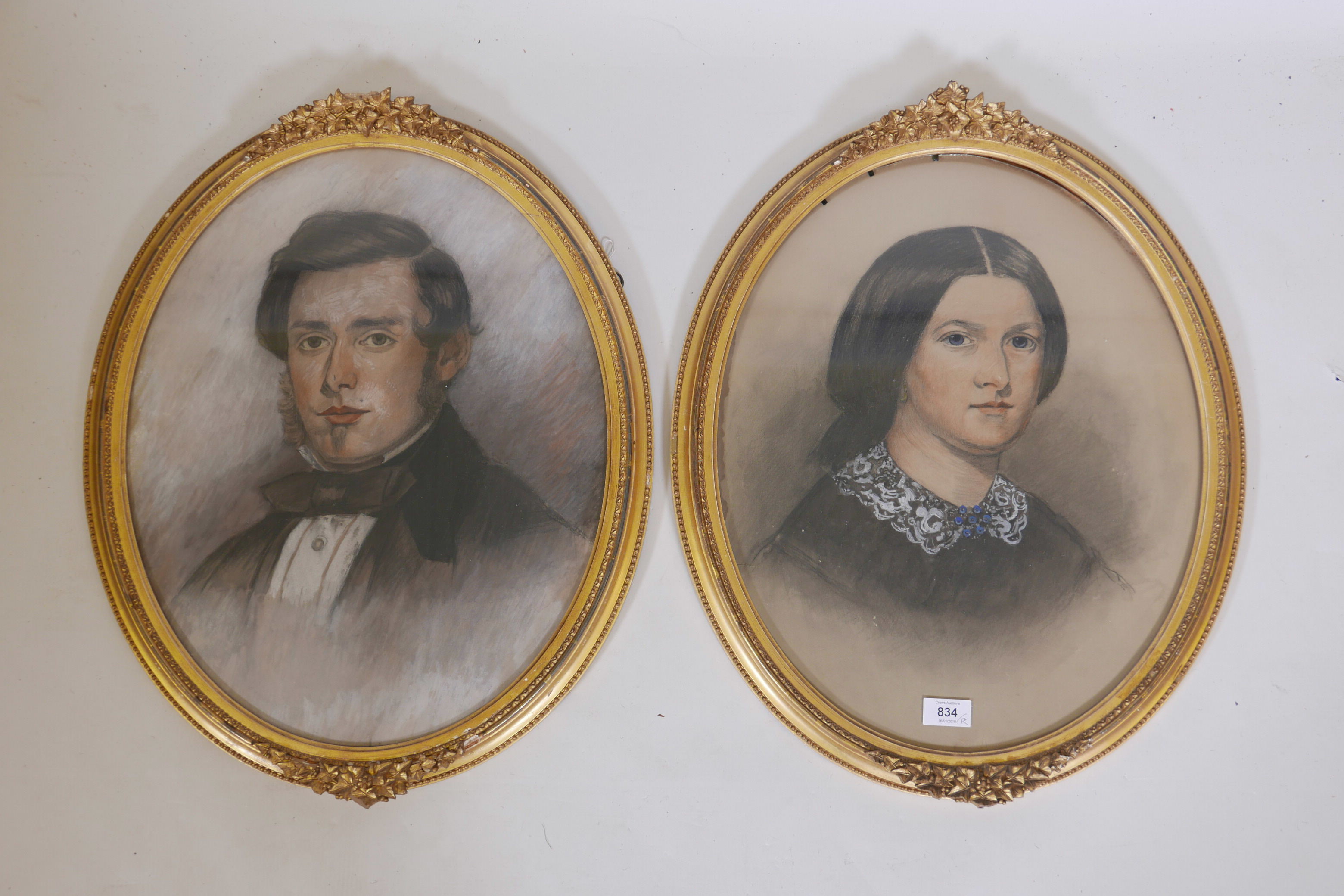 A pair of C19th pastel portraits, heightened with watercolour, in good oval gilt frames 23" x 19"