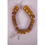 A string of large African amber style beads, 18" long