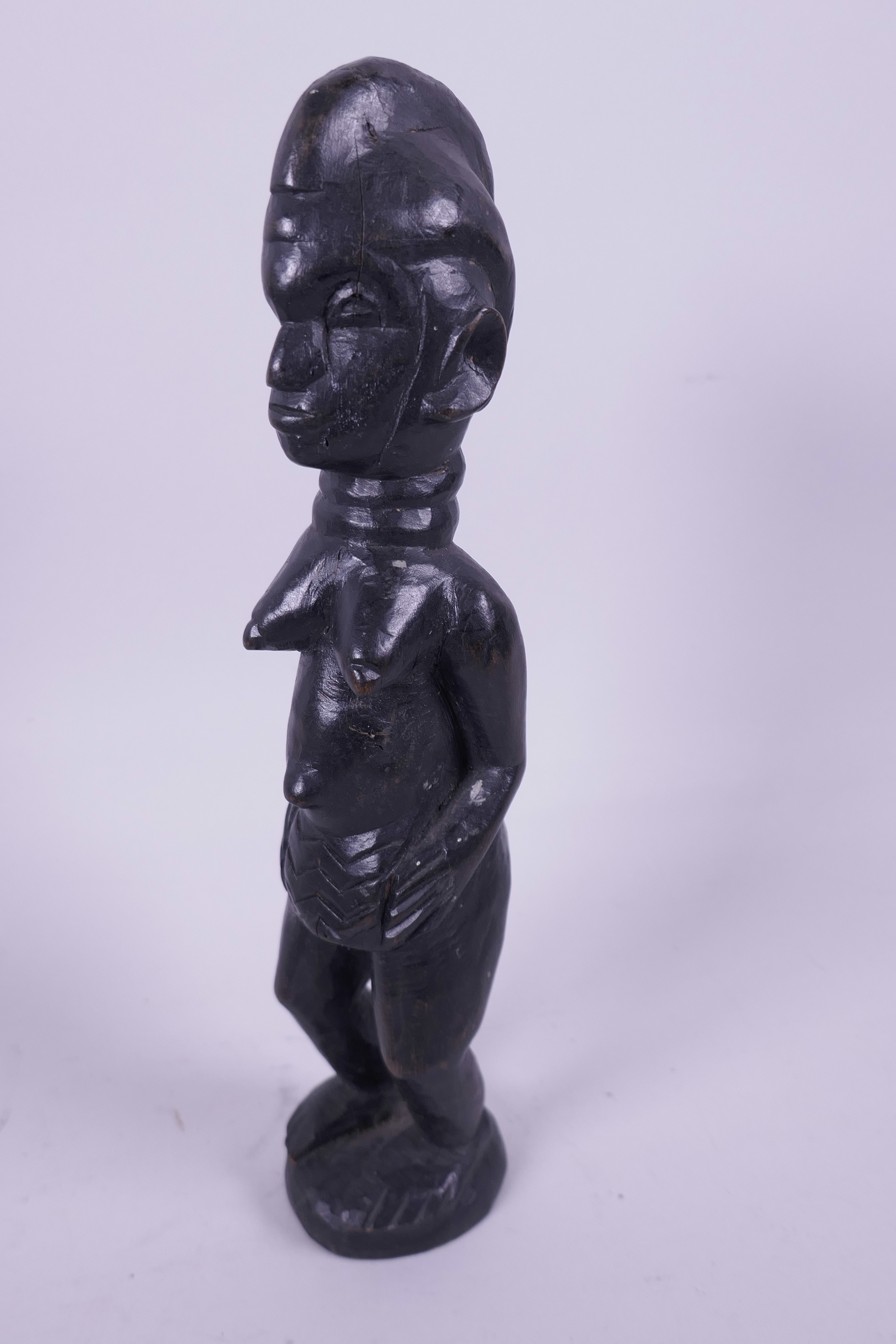 A West African carved wood figurine of a woman, 10" high - Image 2 of 2