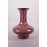 A Chinese coral red glazed ribbed porcelain vase, seal mark to base, 11" high