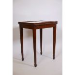 An Anglo-Indian teak table with glazed lift up top, bearing maker's label C. Lazarus and Co Ltd,