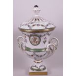 A porcelain pedestal urn and cover with two scroll handles, painted with garlands of flowers and
