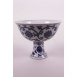 A Chinese blue and white porcelain stem cup with scrolling lotus flower decoration, 6 character mark