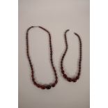 Two strings of graduated cherry amber beads, longest 26"