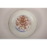 A Chinese blue and white porcelain dish with red enamel dragon decoration, 6 character mark to base,