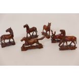 A set of six carved wood figures of horses, 3" high