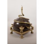 An ormolu mounted red marble centrepiece decorated with a coiled serpent, 8" x 8", 13" high