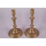 A pair of French ormolu candlesticks with engraved decoration, 8½" high