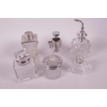 A collection of perfume bottles, atomisers etc, with hallmarked and silver plate collars and lids