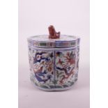 A Chinese wucai porcelain shaped pot and cover with a kylin knop and dragon decoration, 6