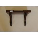 A Victorian oak wall bracket with carved shaped supports, 17" x 11" x 12"