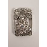 A Chinese silvered metal pendant decorated with a jolly Buddha, 2" x 1"