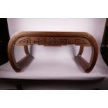 A Chinese hardwood altar table with scroll end supports and carved geometric pattern, 15" x 32" x