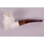 An antique meerschaum and tortoiseshell pipe, the bowl carved as a Saracen's head, 5" long in fitted