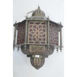 An Eastern brass hanging lantern, with pierced and engraved decoration, 30" long