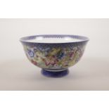 A Chinese polychrome porcelain rice bowl with enamelled floral decoration, 6 character mark to base,