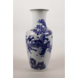 A Chinese blue and white porcelain vase decorated with women and children in a garden, 9½" high