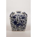 A Chinese blue and white pottery flask decorated with handles in the form of dragons, the sides