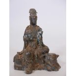 A Chinese bronze figure of Quan Yin seated on a recumbent elephant, impressed mark verso, 10" hig