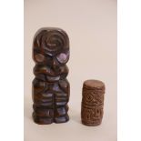 A Maori carved wood Tiki figure with inset mother of pearl eyes, and a terracotta ornament, 4.5" h