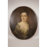 An C18th Irish oil on canvas, half length portrait of a young lady, bears label verso, Elizabeth,