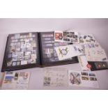A stamp album containing world postage stamps, first day covers from Spain, Russia and Malta, two