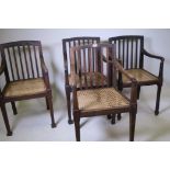 A set of four colonial elbow chairs with cane seats and slat backs, possibly Australian