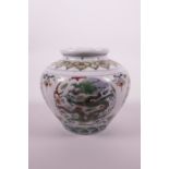 A Chinese doucai porcelain jar decorated with a dragon chasing the flaming pearl, 6 character mark