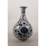 A Chinese blue and white pottery pear shaped vase with scrolling floral decoration, 6 character mark