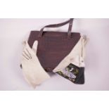 A vintage crocodile skin handbag and a pair of French kidskin dress gloves with embroidered cuffs,
