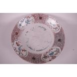 A large Chinese famille rose porcelain shallow bowl decorated with birds and animals, 15"