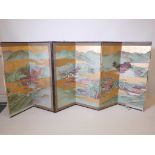 A Chinese six fold table screen, each panel hand painted on a gold leafed ground, late C19th/early