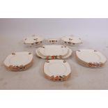 A Palissy hand painted Art Deco six place dinner service, to include three graduated serving plates,