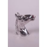 A white metal vesta case in the form of a horse's head, stamped sterling, 1½"