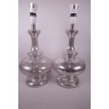 A pair of flecked glass bulbous base table lamps, 18" high