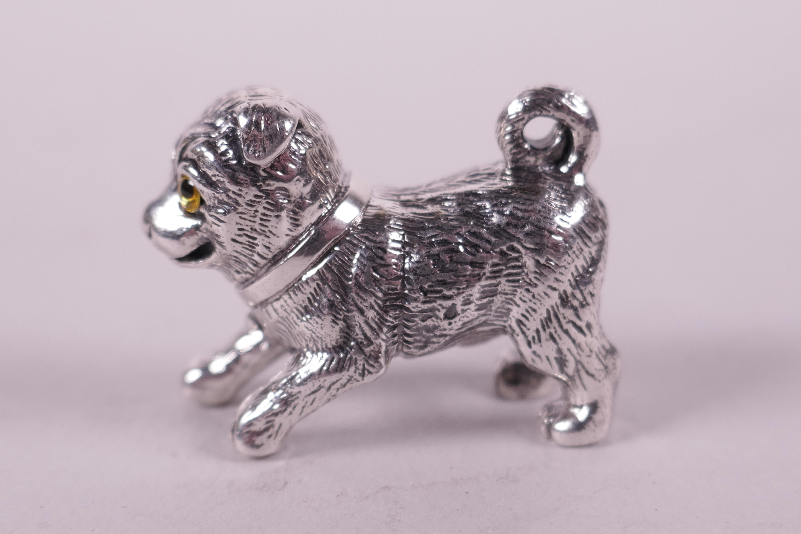 A novelty silver miniature figure of a dog, 1"