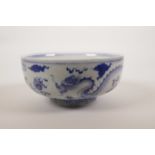 A Chinese blue and white porcelain dragon bowl, 6 character mark to base, 6½" diameter