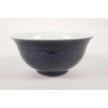 A Chinese blue glazed porcelain rice bowl with lotus flower decoration, 6 character mark, 6"